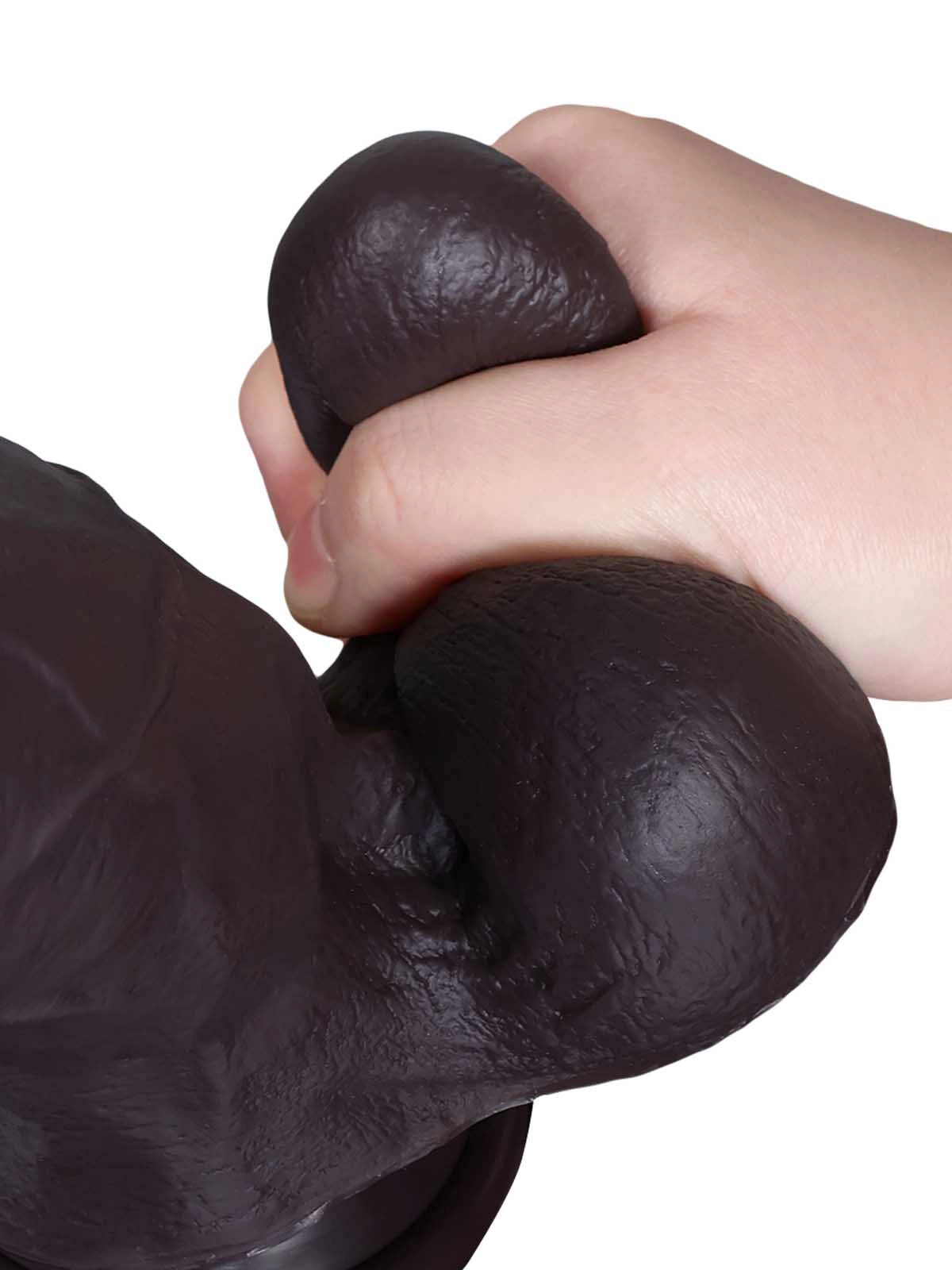Konrad - Realistischer Dildo in Schwarz mit gleitender Haut, Breite & Hoden - 22,3 cm