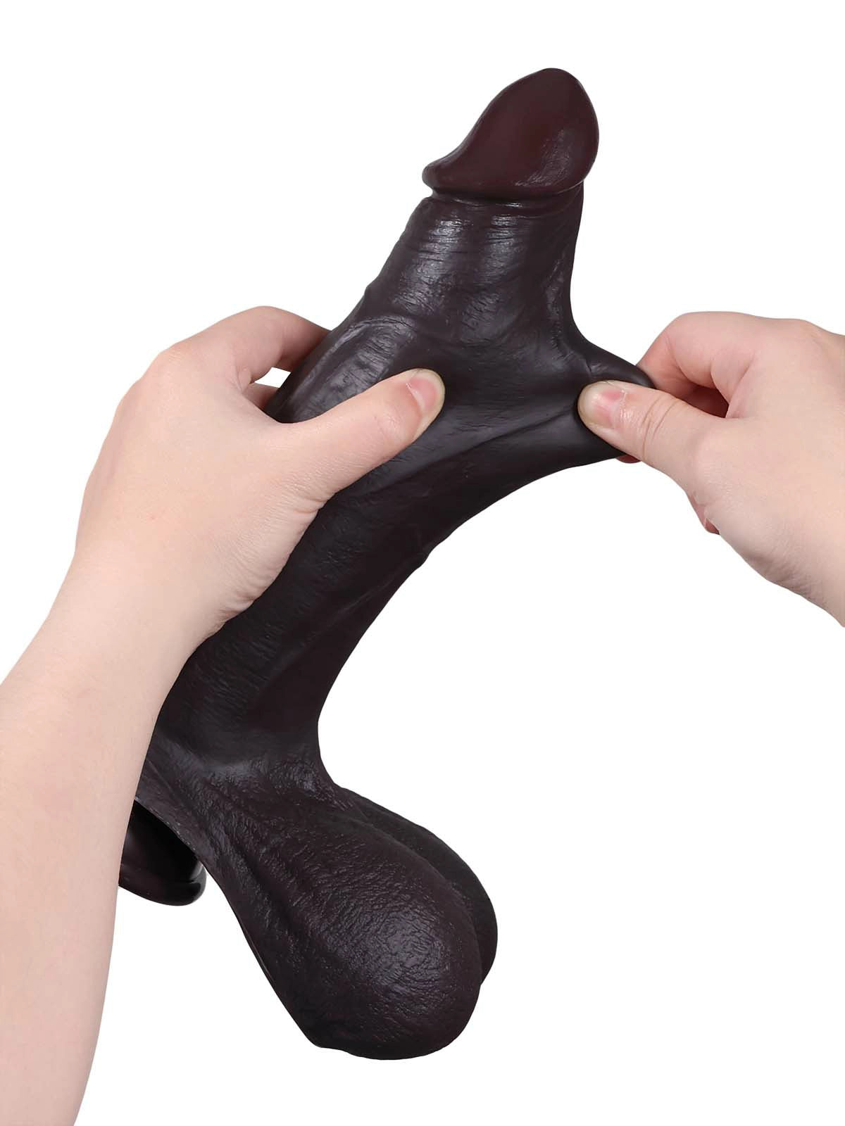 Magnus - Realistischer Dildo in Schwarz mit gleitender Haut - 26,5 cm